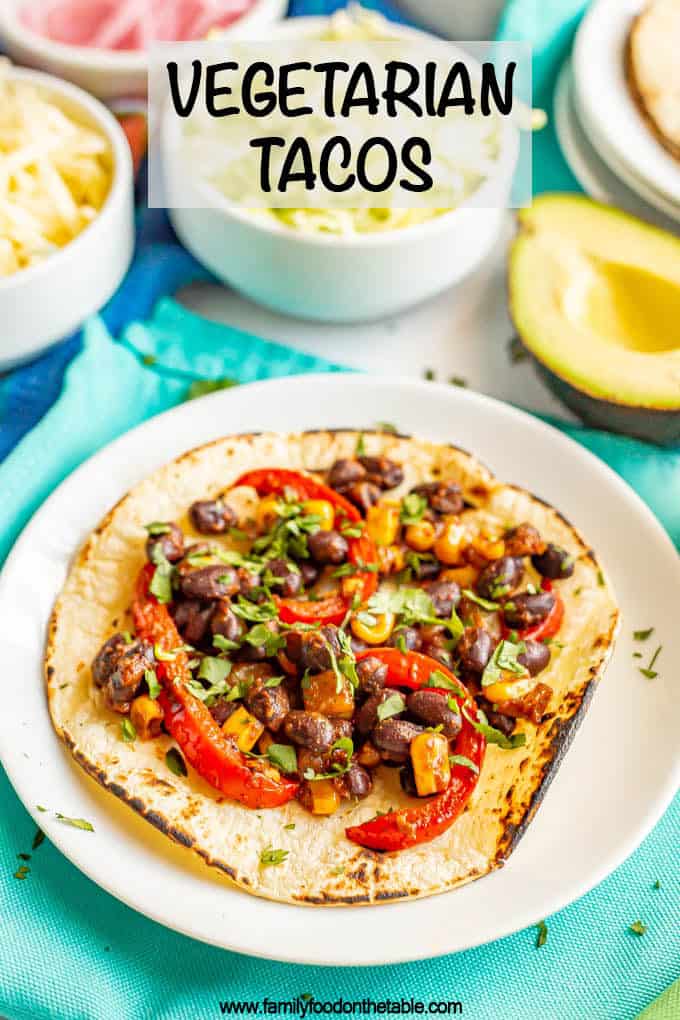 A charred corn tortilla with black bean mixture on top and text box