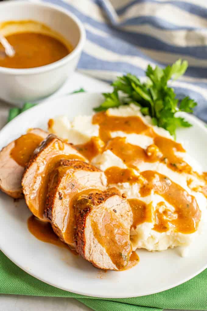 Sliced pork served with mashed potatoes and gravy