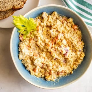 Creamy chickpea salad in a blue bowl
