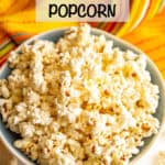 Homemade microwave popcorn served in a large bowl with extra popcorn scattered around and a text box on top