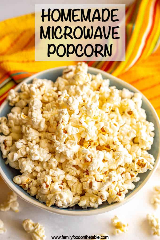 Homemade microwave popcorn served in a large bowl with extra popcorn scattered around and a text box on top