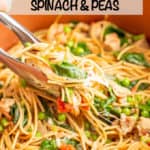 Tongs picking up a scoop of spaghetti noodles with chicken sausage, spinach and peas from a large copper pot and a text overlay on top