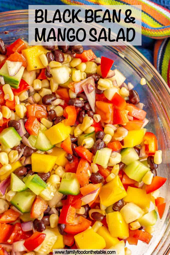 A colorful mixed salad of black beans, mango and veggies