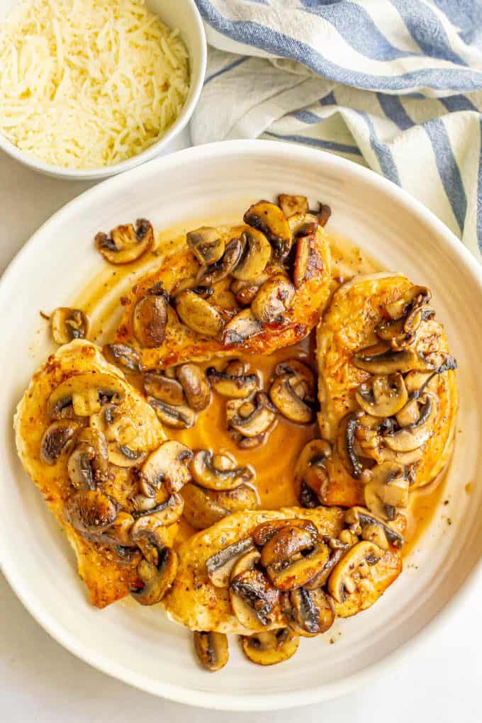 Seared chicken breasts topped with sauteed mushrooms