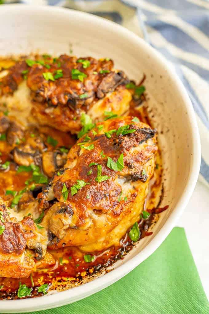 Chicken breasts Lombardy is a delicious Italian chicken dinner with tender, flavorful chicken breasts topped with melty cheese, mushrooms and a Marsala wine sauce that brings it all together. A baking dish with chicken breasts smothered with cheese and mushrooms after baking