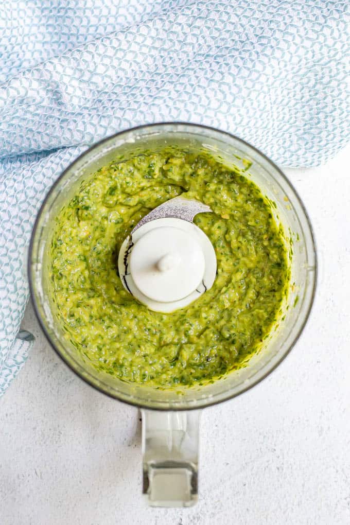 Basil pesto being made in a food processor