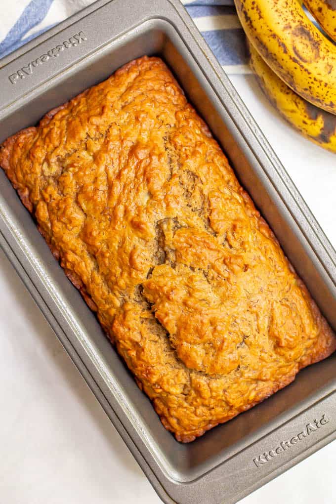 Baked loaf of banana bread in a bread pan