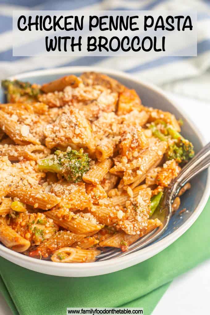 A large blue and white bowl with penne pasta, chicken and broccoli coated in marinara and Parmesan cheese and a text box overlaid on the photo