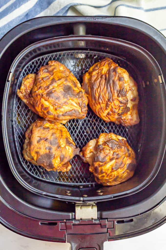 Cooked, browned chicken thighs in an Air Fryer