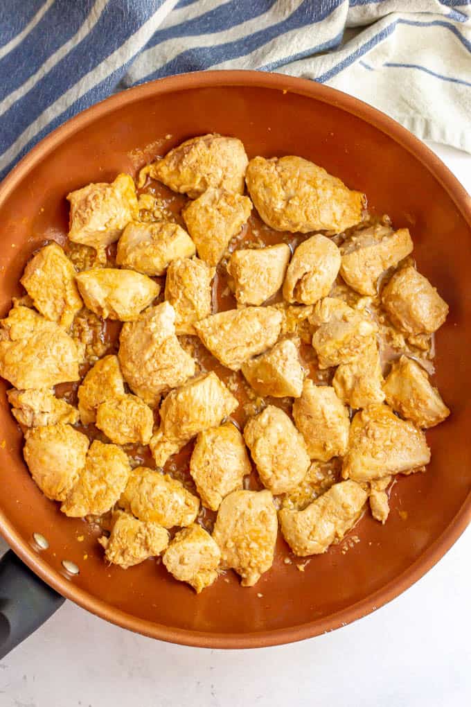 Cooked cubed chicken in a large skillet