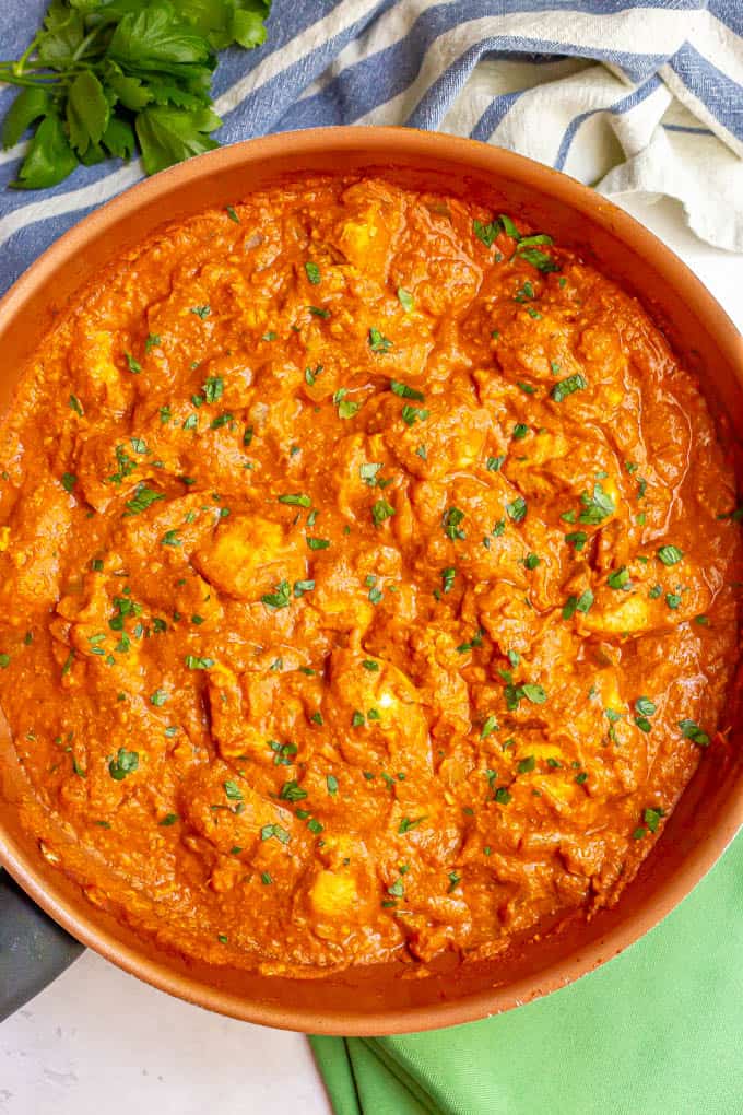 Chicken tikka masala with a tomato sauce in a large skillet