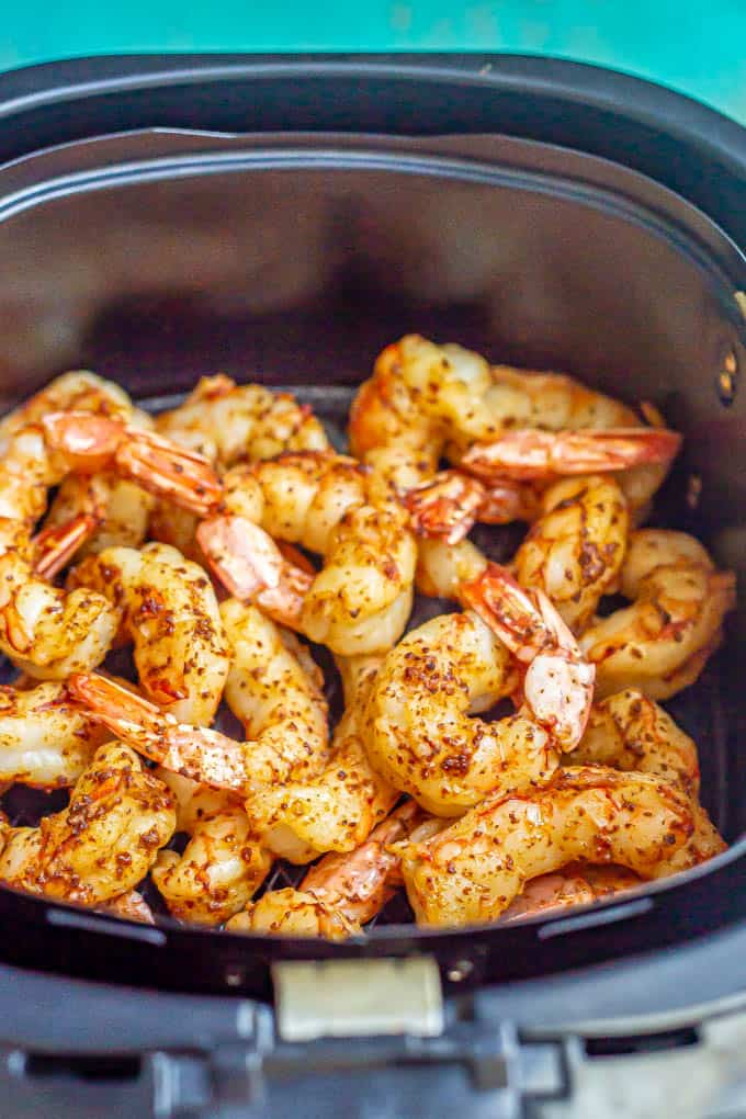 Cooked seasoned shrimp in an Air fryer tray