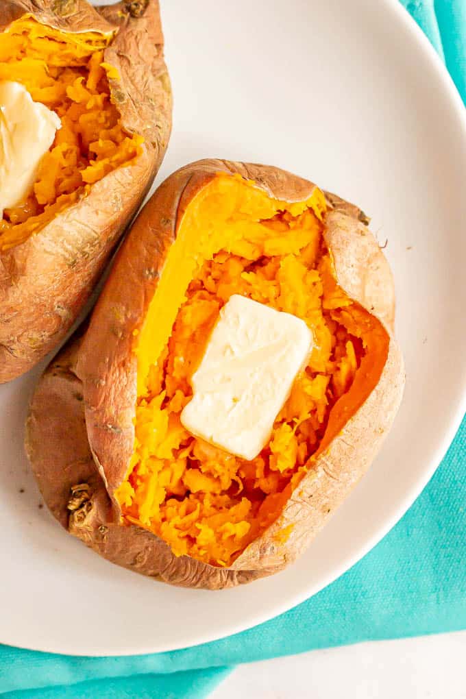 Overhead shot of a sweet potato with a pat of butter in it