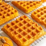 Large square pumpkin waffles on a cooling rack with a text box on top