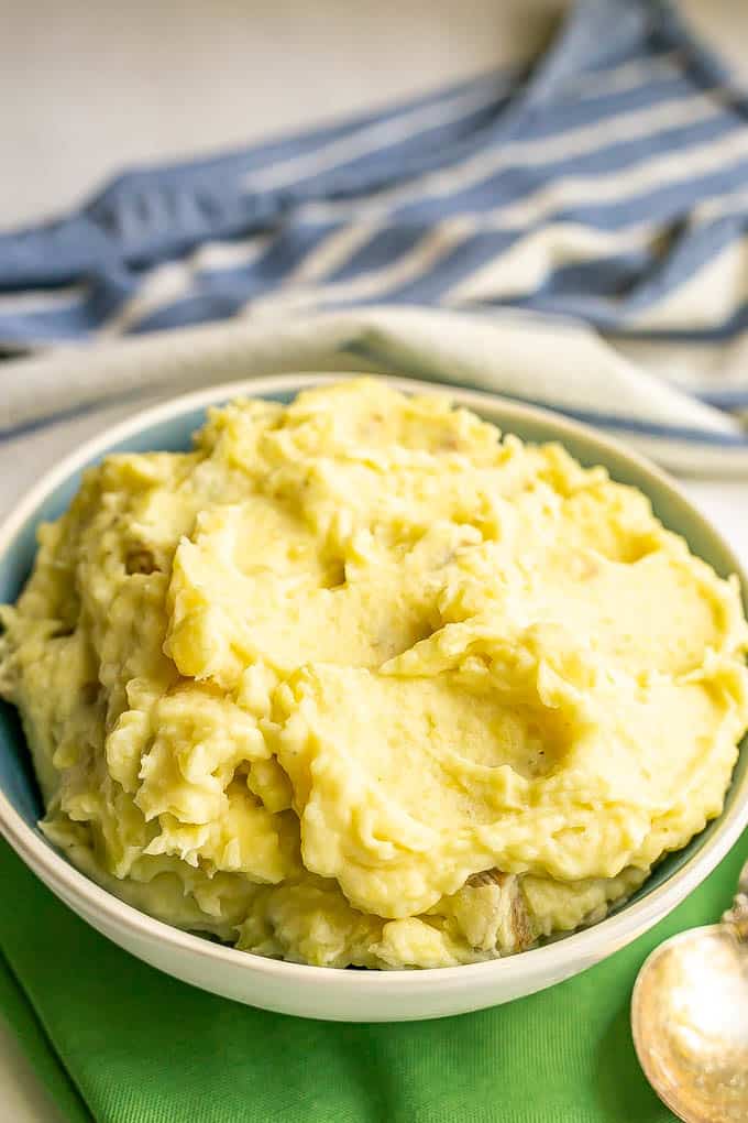 Creamy mashed potatoes served in a white and blue bowl