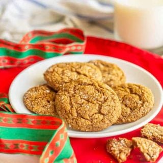 A plate of ginger snaps with holiday ribbons and napkins nearby