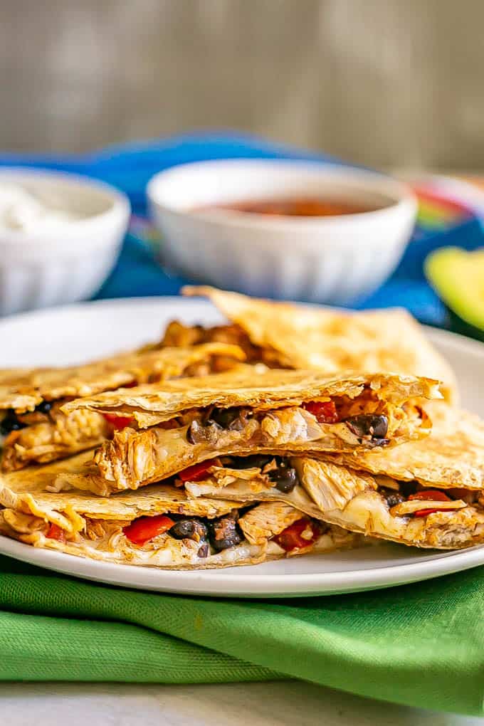 Stacked cooked quesadillas with turkey, black beans and cheese