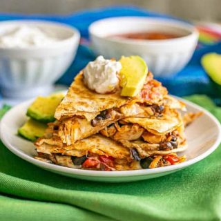 Turkey and black bean quesadillas stacked on a white plate