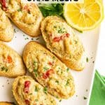 Baguette slices with a creamy crab mixture on top and a text overlay on the photo
