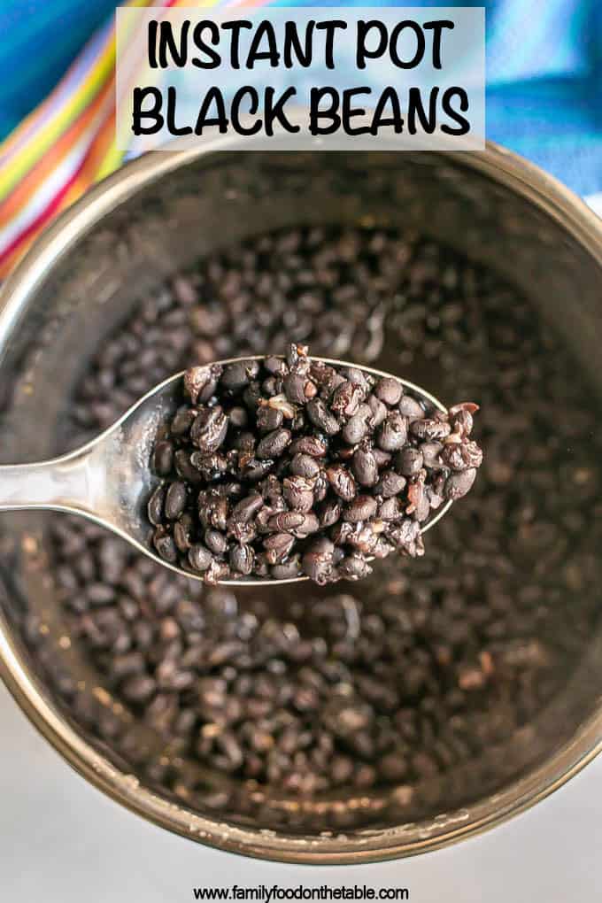 A spoonful of cooked black beans being lifted up from a pressure cooker with a text overlay on the photo