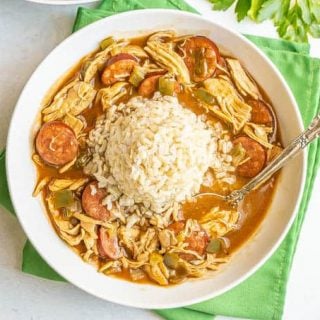 Chicken and sausage gumbo with rice in a wide, low bowl