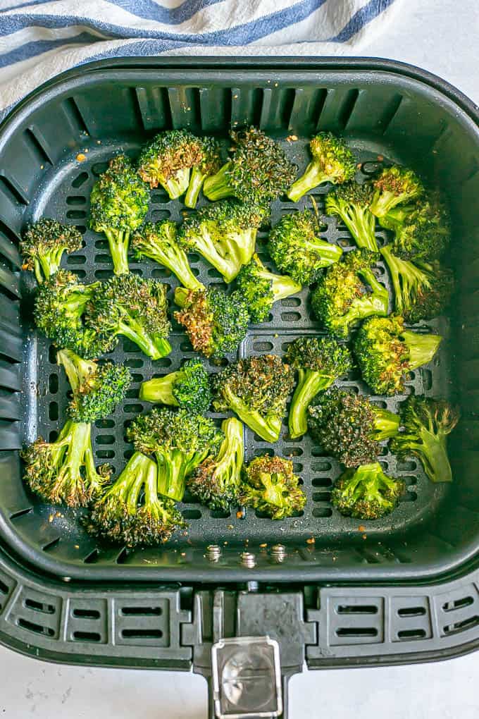 Cooked, browned broccoli in an Air Fryer tray