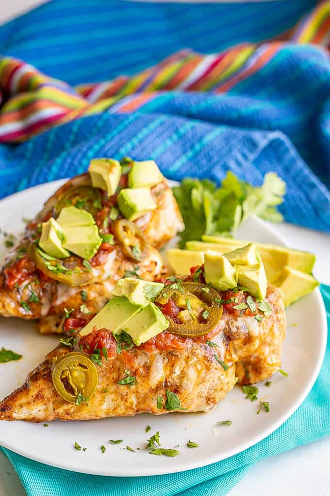 Cheesy grilled chicken breasts topped with salsa, avocado, jalapeños and cilantro