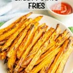 A plate full of cooked, browned Air Fryer sweet potato fries with a text overlay on top