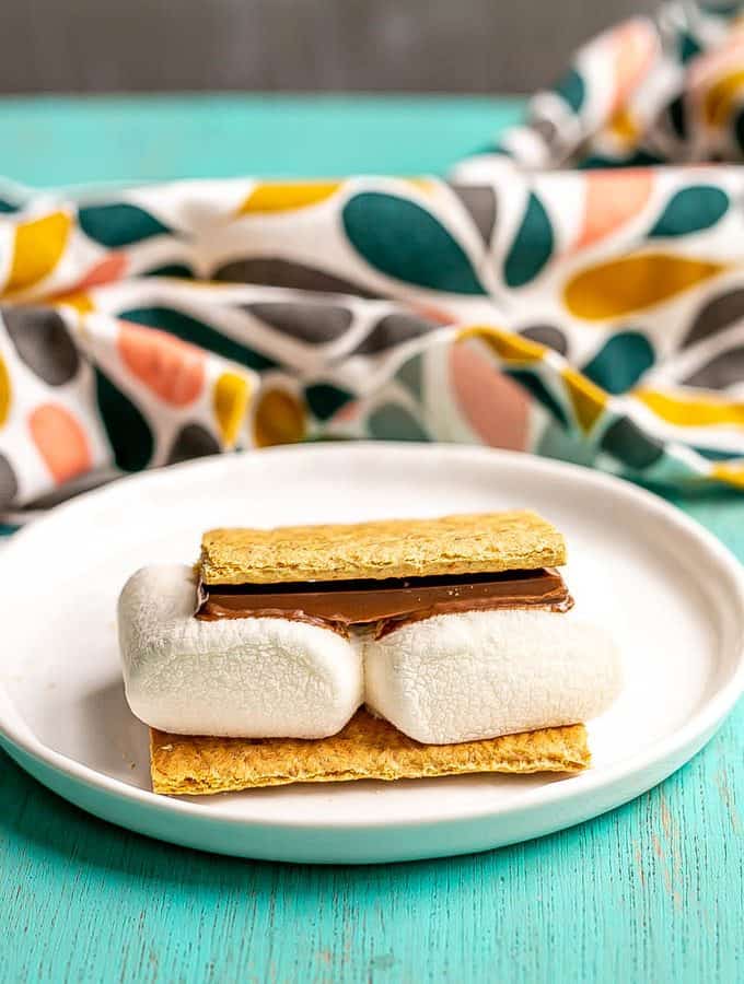 An individual smore on a small white plate
