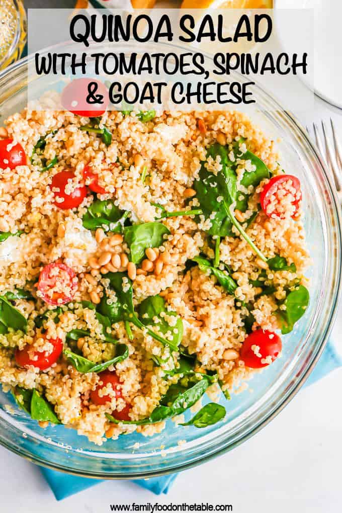 A large glass bowl with a quinoa spinach salad mix and a text overlay on the photo