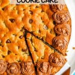 A slice being taken out of a chocolate chip cookie cake with a text overlay on the photo