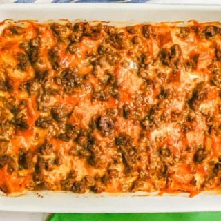 A baked breakfast casserole with sausage, egg, bread and cheese