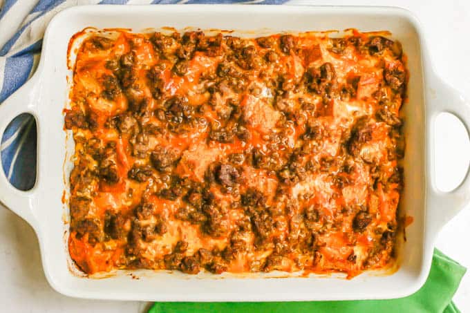 A baked breakfast casserole with sausage, egg, bread and cheese