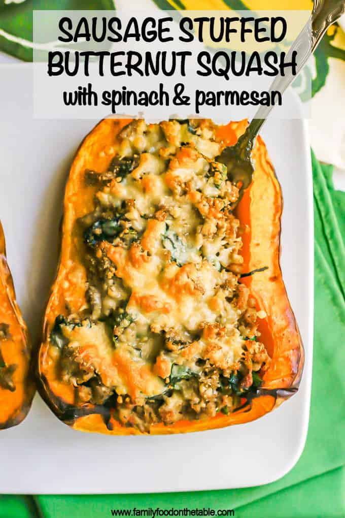 Half of a butternut squash stuffed with turkey sausage and spinach and topped with browned Parmesan cheese with a fork stuck in it and a text overlay on the photo