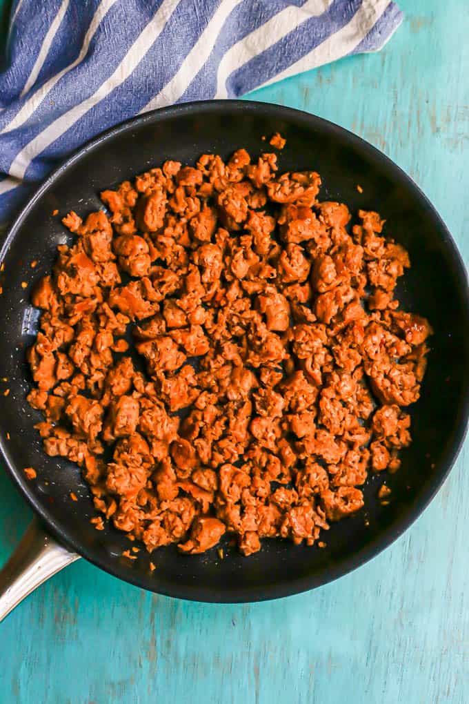 Cooked, crumbled turkey sausage in a large skillet