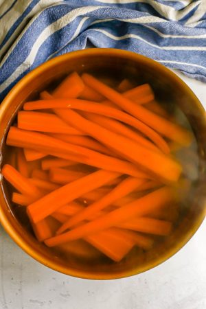 Carrots in a pot of water after being boiled until tender
