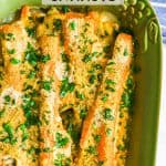 Roasted carrots in a creamy sauce with toasted breadcrumbs on top and chopped parsley sprinkled over the baking dish with a text overlay on the photo