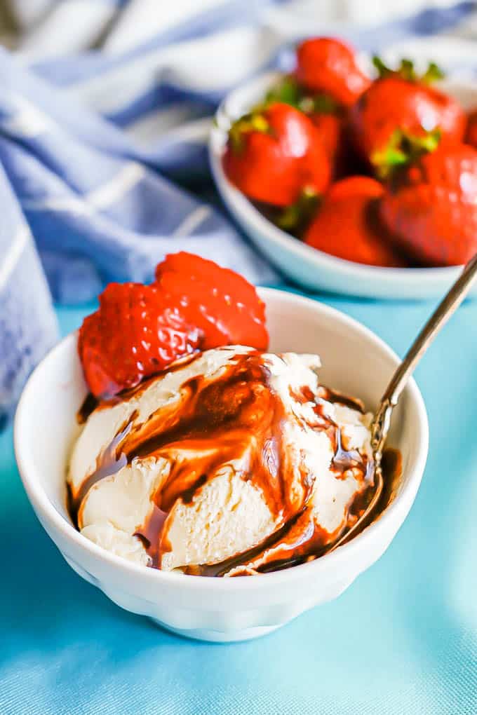 A bowl of vanilla ice cream drizzled with homemade chocolate sauce