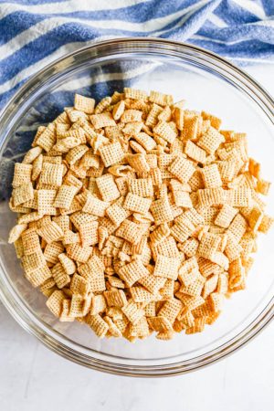 Rice chex cereal in a large glass bowl