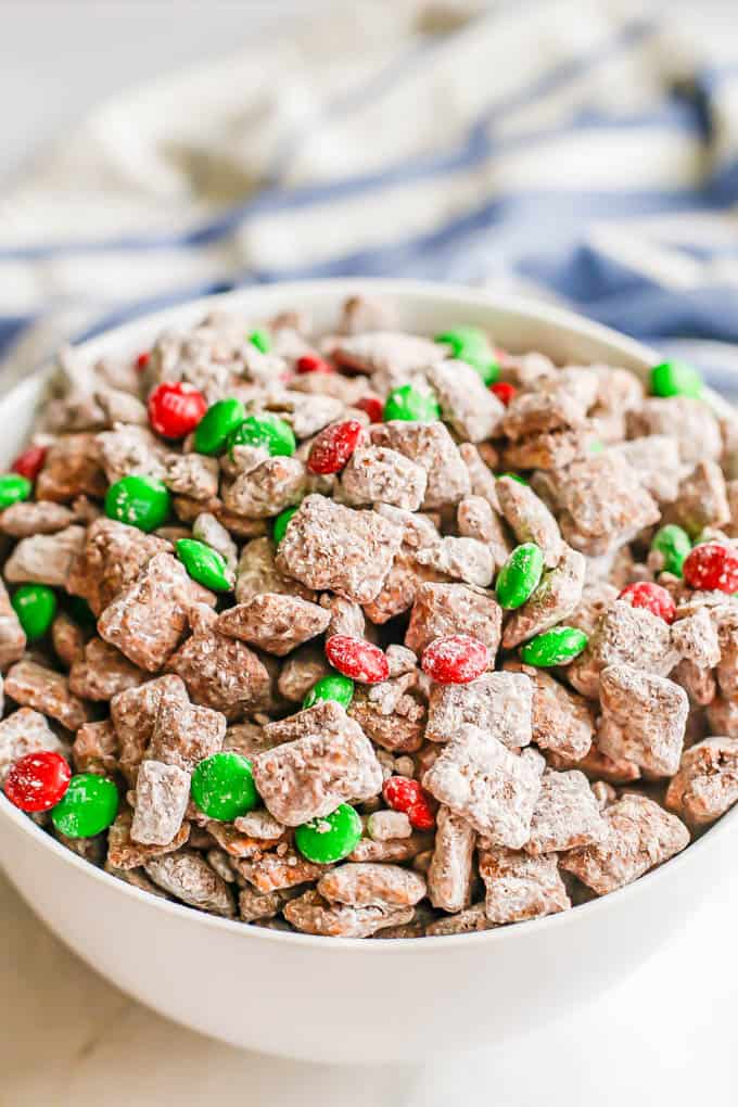 Close up of reindeer chow snack mix in a large white bowl