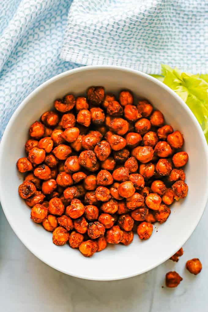 A small white bowl with seasoned and cooked Air Fryer chickpeas