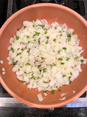 Onion, jalapeno and garlic sautéed in a copper skillet