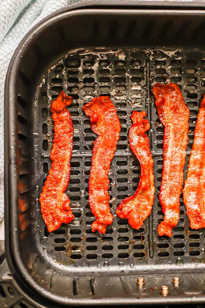 Close up of cooked bacon in an Air Fryer tray