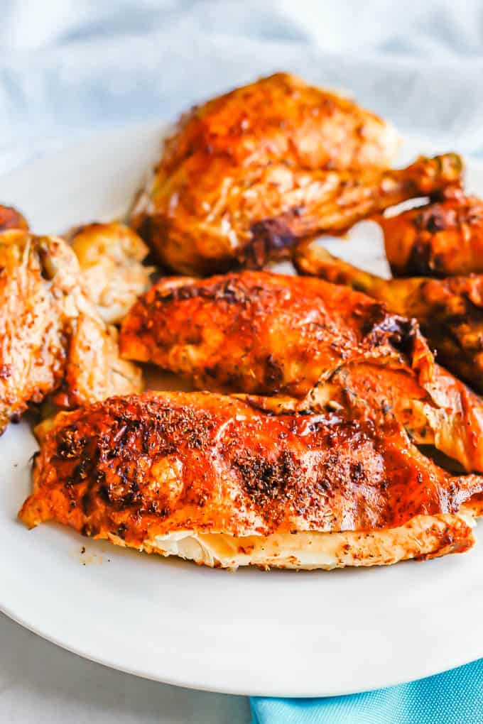 Close up of a rotisserie roasted chicken breast on a platter