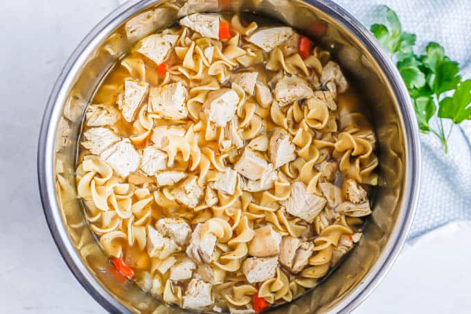 Chicken noodle soup in an Instant Pot after being cooked
