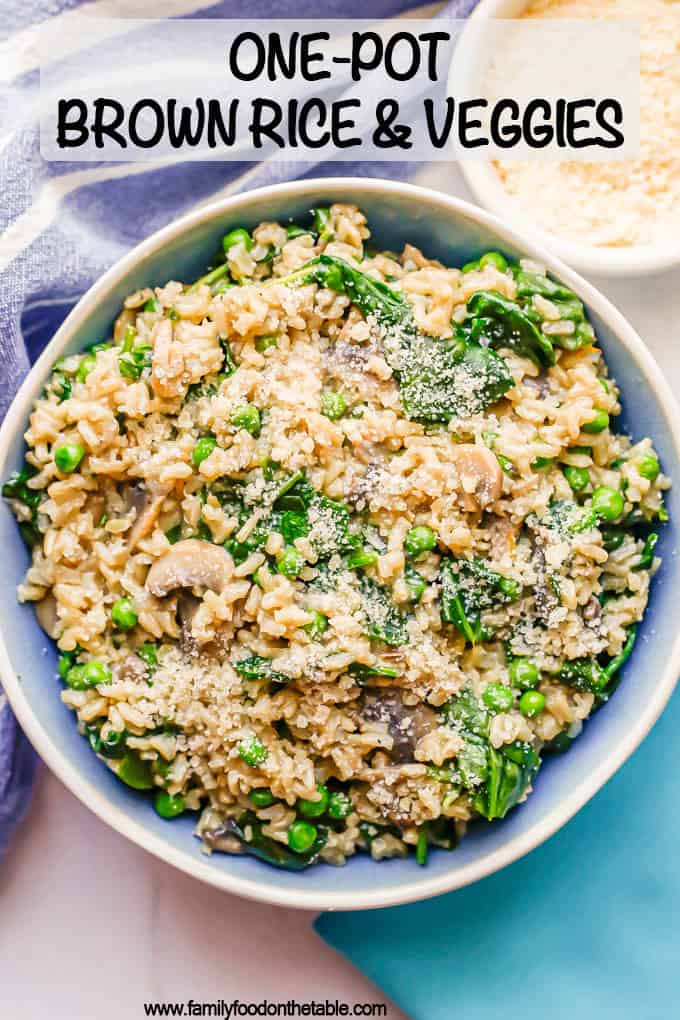 A mix of brown rice and veggies with Parmesan cheese served in a blue and white bowl with a text overlay on the photo