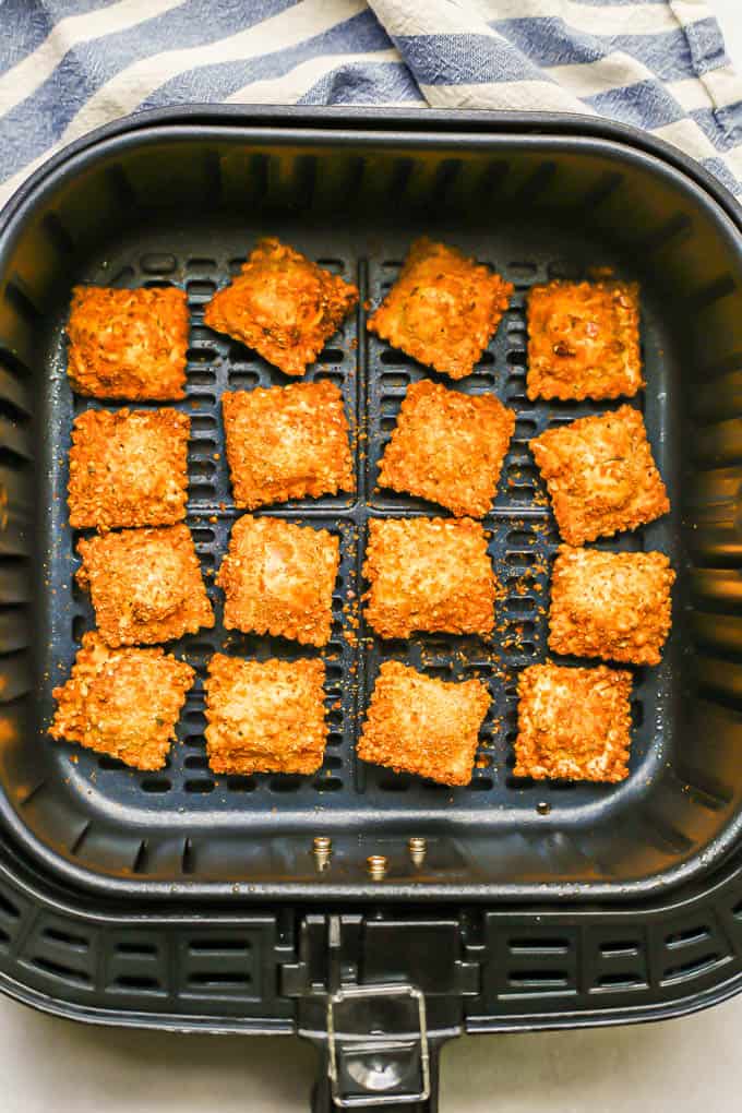 Golden brown ravioli in an Air Fryer after cooking