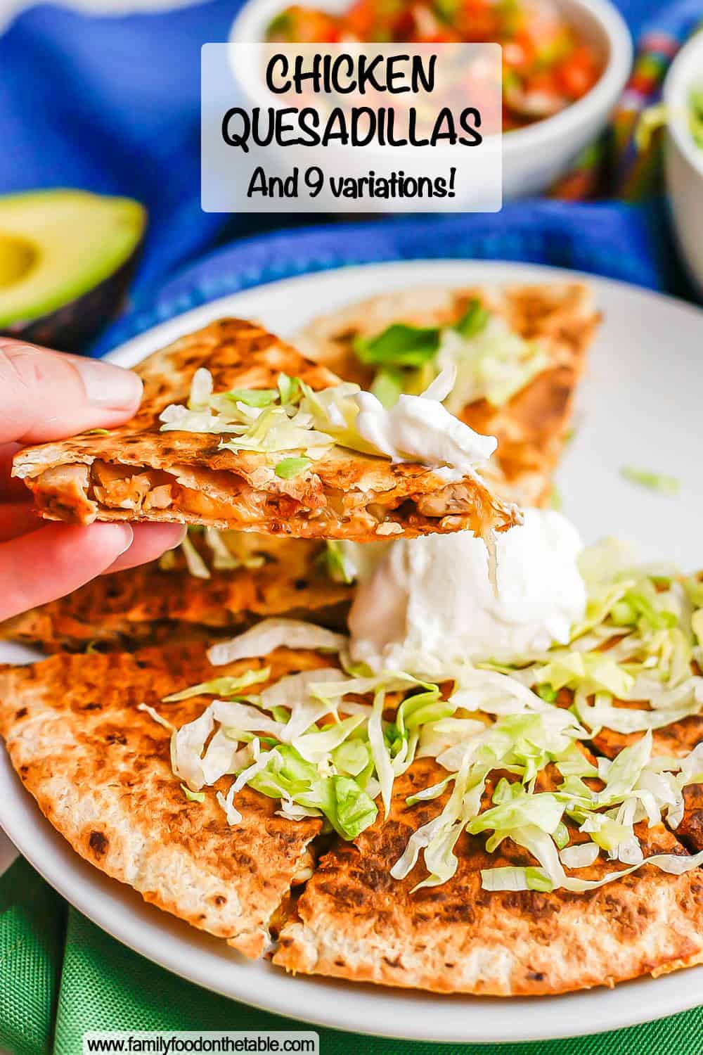 A hand holding up a cheesy chicken quesadilla piece with lettuce and Greek yogurt and a text overlay on the photo