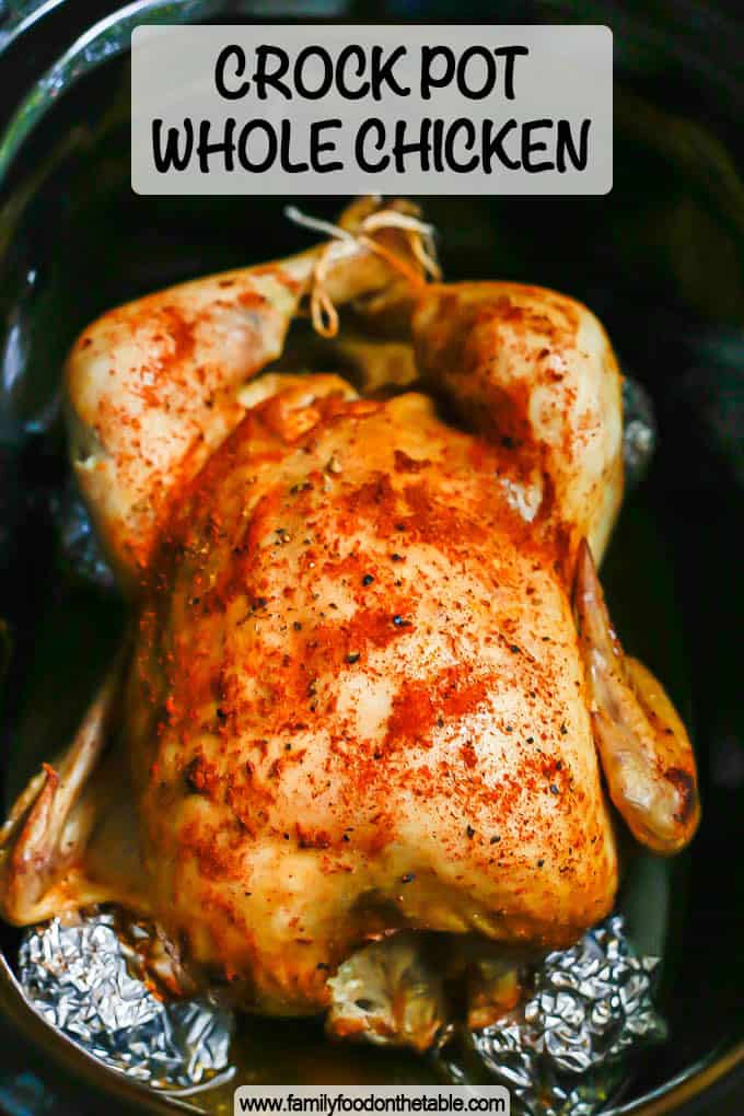 A seasoned and cooked whole chicken in a crock pot with a text overlay on the photo