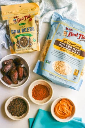 Ingredients laid out on a counter to make chocolate peanut butter energy balls